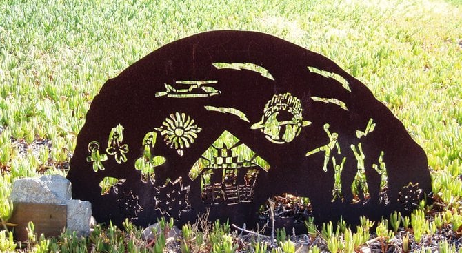  One of several rusted metal sculptures made by students in a small park-ette in Emerald Hills.