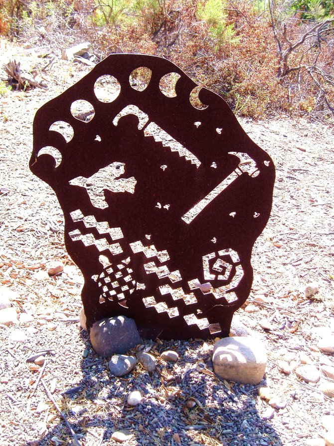 One of several rusted metal sculptures made by students in a small park-ette in Emerald Hills.