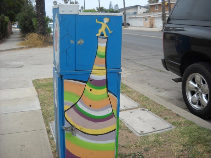 Life is a balancing act on utility box art in Ocean Beach.