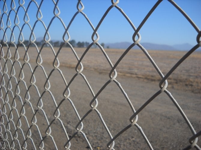 Fenced area along Heritage Road overlooking Brown Field.