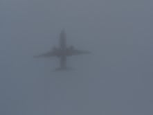 Ghostly apparition of a airplane on a foggy day over Ocean
Beach.