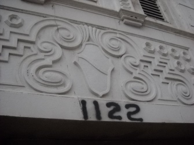 Ornate moldings downtown but spray-painted address numbers.
