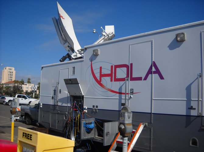 TV trucks gather at the Cruise Ship terminal in anticipation of the Carnival Splendor's arrival by tow.