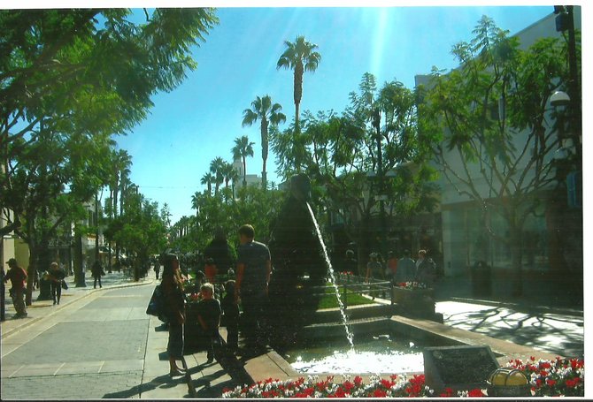 A family enjoys the fountain at the Third Street Promenade in Santa Monica.