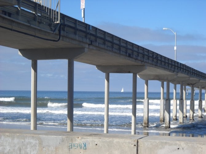  Ocean Beach Pier with a friendly white sailboat on the horizon.