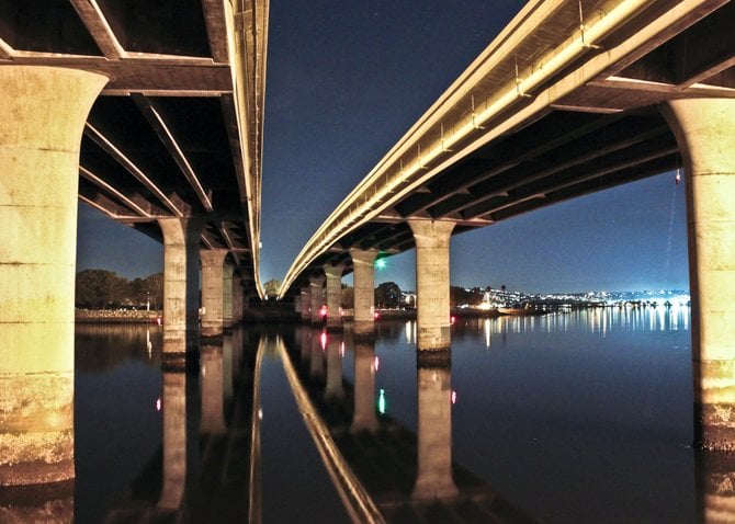 On a crisp clear night the Ingraham bridge creates a stunning reflection off Mission Bay
