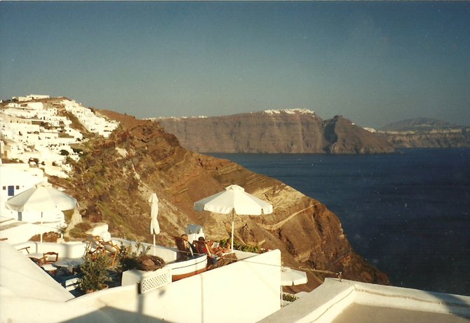 Enjoying a magnificent view in the village of Oia on the Greek island, Santorini.