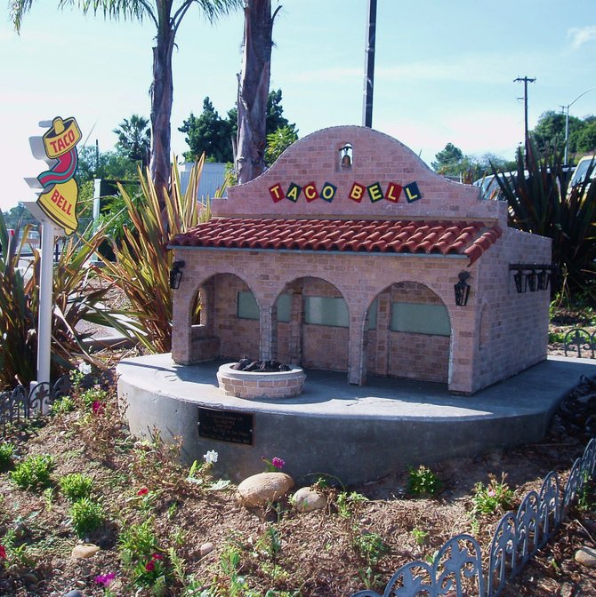 This tiny Taco Bell model sits in the garden next to the drive-thru at the actual Taco Bell restaurant on College and University. It is apparently an homage to the first Taco Bell that was ever built in
San Diego, and it was on this actual site. The current building is very modern looking. I kept thinking that Barbie and Ken would love this old school Taco Bell. It's just their size.