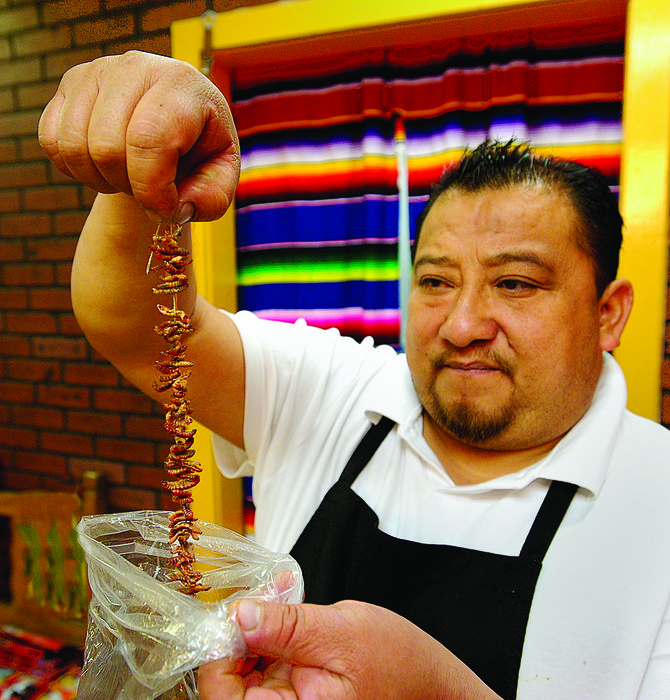 Co-owner Simon shows off "gusanos de maguey" (worms).