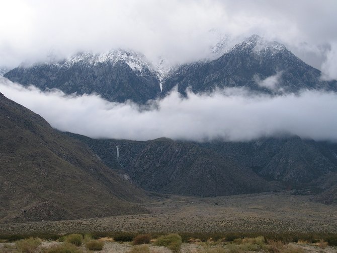 The north side of San Jacinto Peak on December 22nd, 2010. This photo is taken just off Highway 111, after a massive storm.  Note the rain-induced waterfall flowing left of center on the mountain.