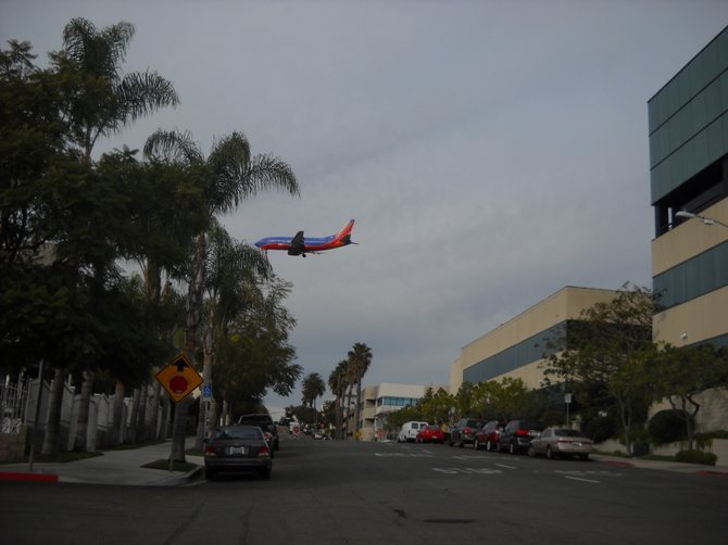 Southwest planes swoops down over Banker's Hill for a landing.