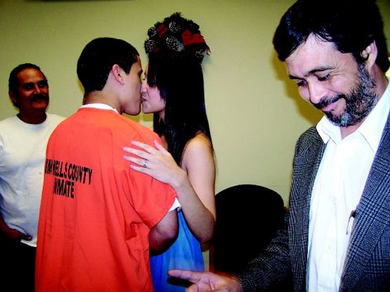 Killer wedding: Convicted murderer Justin Lopez kisses his bride, Mariah Mierya Cavazos, in a jailhouse lobby.