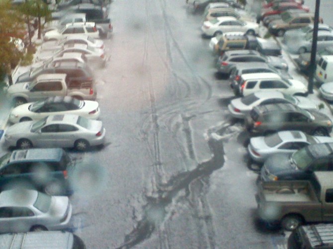 March 21, 2011 "THE HEAVENS OPENED" Hail coming down...Looks like snow...Amazing show. Looking out from my work window.