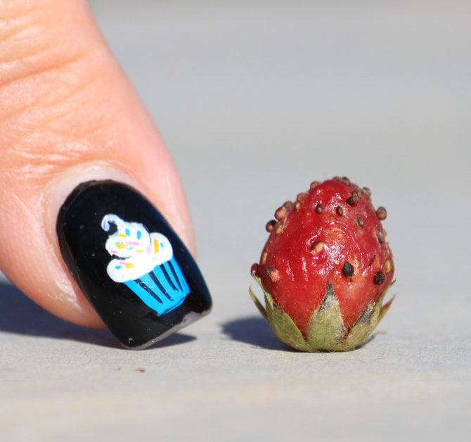 My smallest strawberry from my garden and my niece's "cupcake" fingernail.
"it's a Vilma!"  Vilma Ruiz Pacrem