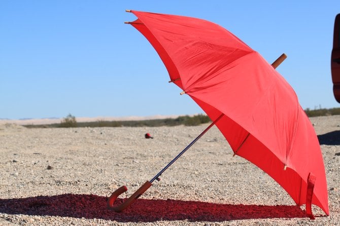 Whenever I am out in the hot desert, I take my trusty umbrella with me.  The outskirts of Holtville, CA.