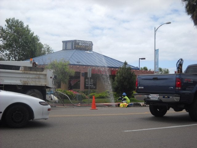 Free car wash along Midway Dr. as water main breaks.