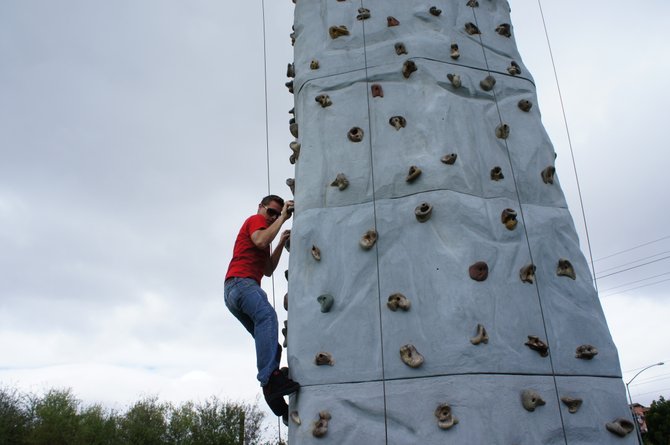 Street Team Nate free climbing this unattended rock wall, seeing how long it will take to get yelled at.