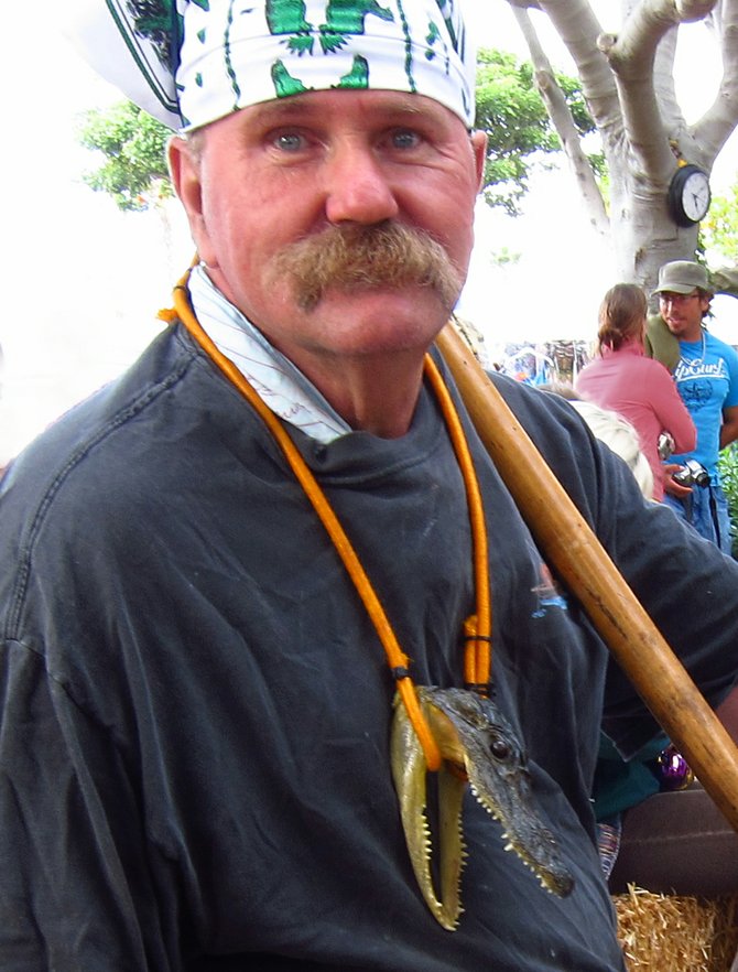 This man traveled from Louisana to attend our Gator by The Bay festival at Spanish Landing Park.  Check out the necklace.
