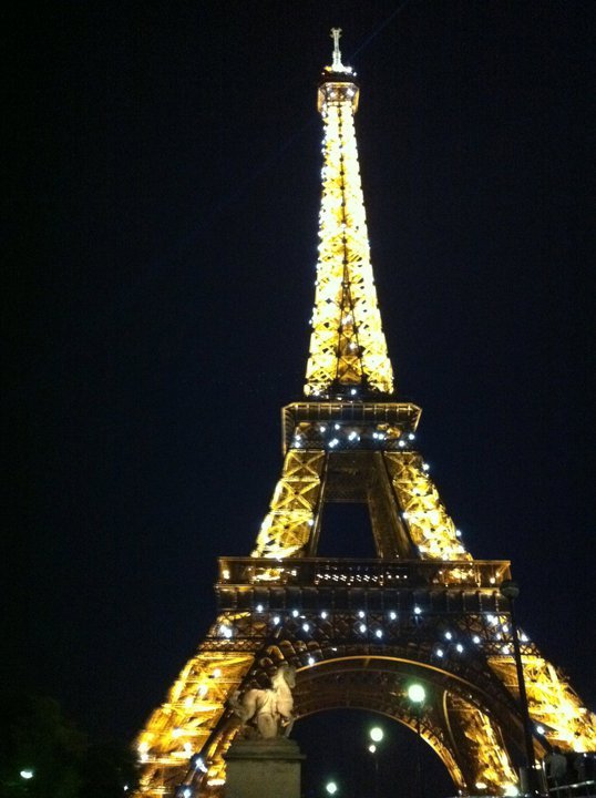 The Eiffel Tower lit up at night.
