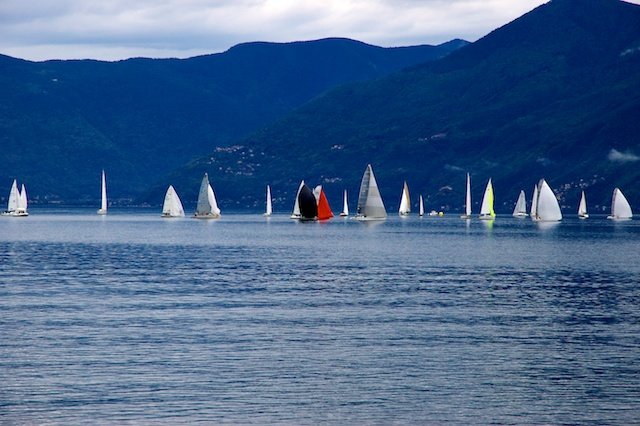 Sailboats on Lago Maggiore, Swiss Alps in the background