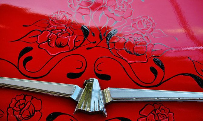 Lovely designs on a red hot rod at the San Diego Fair.