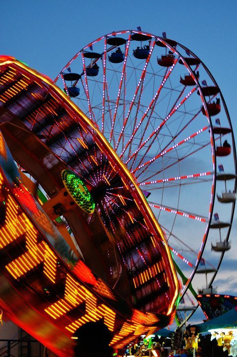 Tilt-a-Whirl and Farris Wheel at the San Diego Fair.