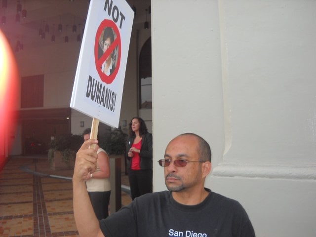 At anti-Dumanis rally downtown, a protester makes a point.