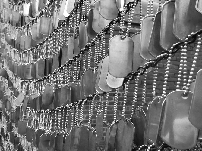 Dog tags hang in support of our armed service men and women at the Memorial Garden in Boston.