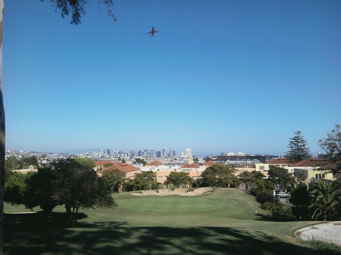Golf picture, from sail-ho golf course. 5th hole overlooking downtown, with airplanes going by..