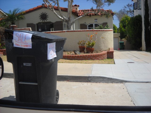 Trash can advertising in posh Point Loma neighborhood.