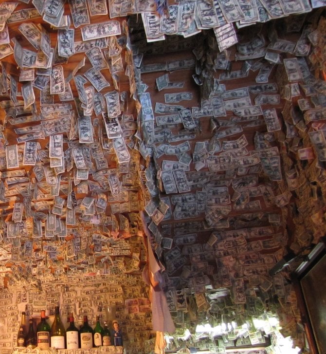 Tasting room ceiling lined with dollar bills