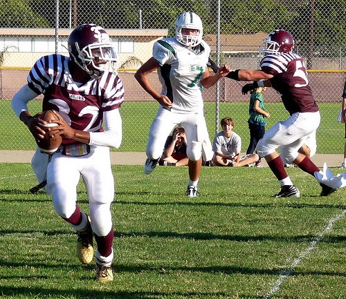 Kearny quarterback Ahascaan Vanderkuur looks for a receiver on the roll out