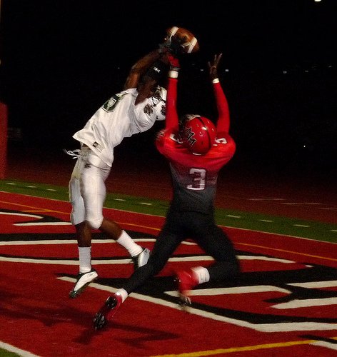 Helix defensive back Jimmy Pruitt makes a leaping interception in front of Mount Miguel receiver Adrian Adams