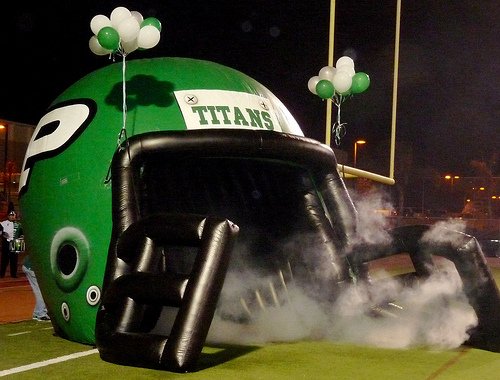 Poway players jogged out of this inflatable helmet before their game against Ramona