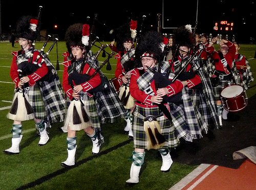 Members of Helix’s band take the field in traditional Highlander garb