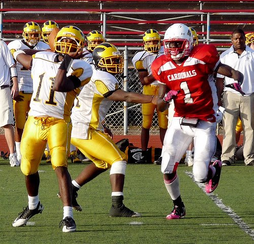 Mission Bay quarterback Nate Long throws the ball with Hoover defensive end Dame Ndiaye closing in