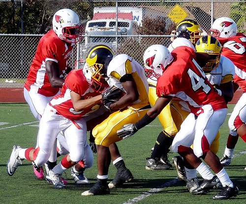 Mission Bay running back Chris Byrd wrapped up by a group of Hoover defenders