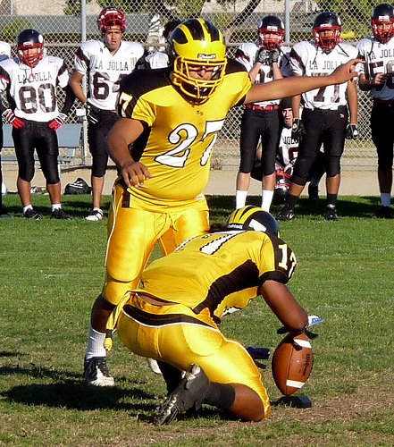 Mission Bay kicker Jorge Duarte attempts a field goal with Buccaneers receiver Marcus Jasper holding