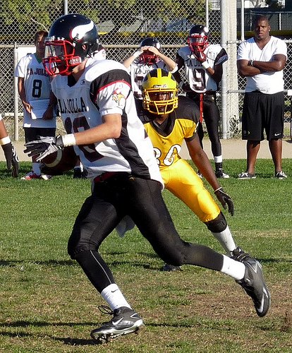 La Jolla receiver Cory Wagner carries the ball around end