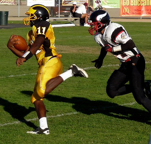 Mission Bay quarterback Nate Long outruns a La Jolla defender toward the endzone