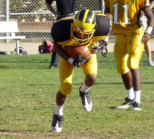 Mission Bay running back Anthony Magee stumbles forward