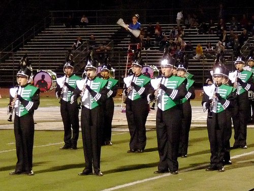Poway’s Emerald Brigade marching band performs at halftime