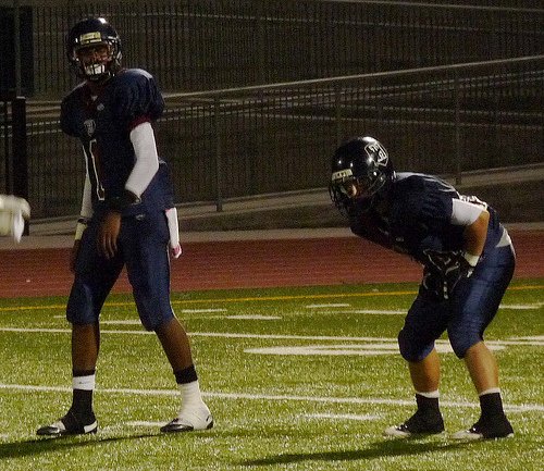 Horizon quarterback Markel Byrd (left) and a Panthers running back in the shotgun