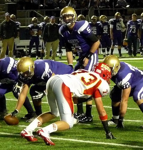 St. Augustine quarterback Evan Crower at the line of scrimmage