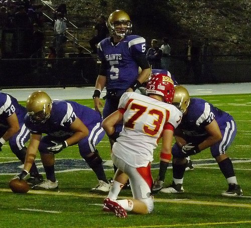 St. Augustine quarterback Evan Crower checks the Cathedral Catholic defense at the line of scrimmage