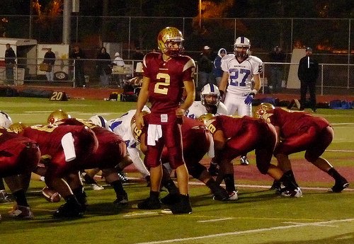 Mission Hills quarterback Hunter Moore checks the play with his backfield