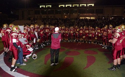 Mission Hills head coach Chris Hauser addresses the Grizzlies after their victory
