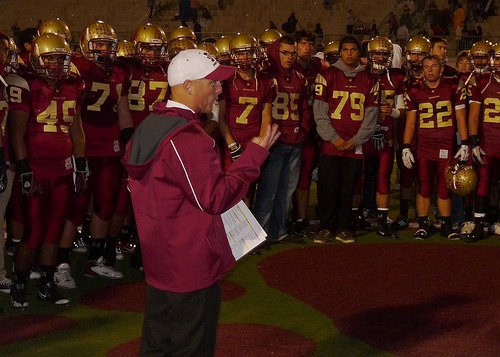 Mission Hills head coach Chris Hauser talks to the Grizzlies after their win