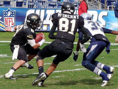 Valley Center running back Travis Bernard tries to use the block of Jaguars receiver Michael McInerny
