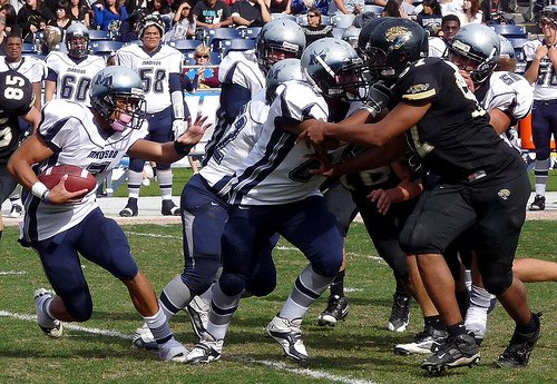 Madison running back Desaan Hardwick runs behind Warhawks blockers